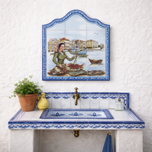 Load image into Gallery viewer, Portuguese Ceramic Tile Wall Panel – Coastal Harbor Fish Market Scene with Blue Azulejo Border (17.5" W x 23.5" H)
