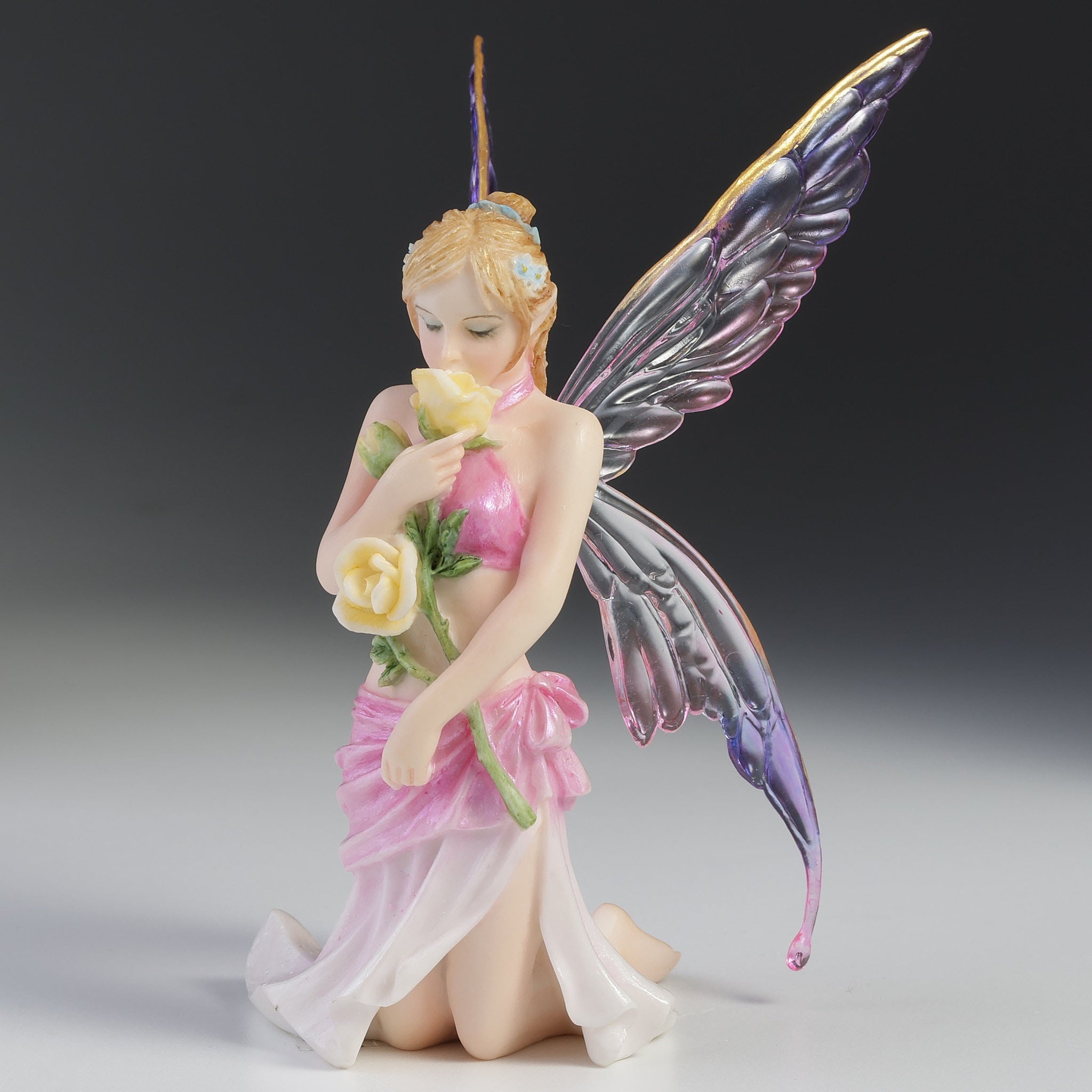 Kneeling Fairy Figurine with Yellow Rose Pink and Purple Winged Fair Portugalia Sales Inc Kneeling Fairy Figurine with Yellow Rose Pink and Purple Winged Fair Portugalia Sales Inc