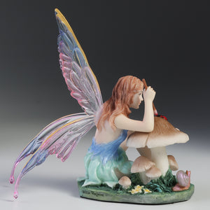 Fairy Figurine Painting Ladybug on Mushroom – Colorful Winged Fairy Statue with Nature Accents